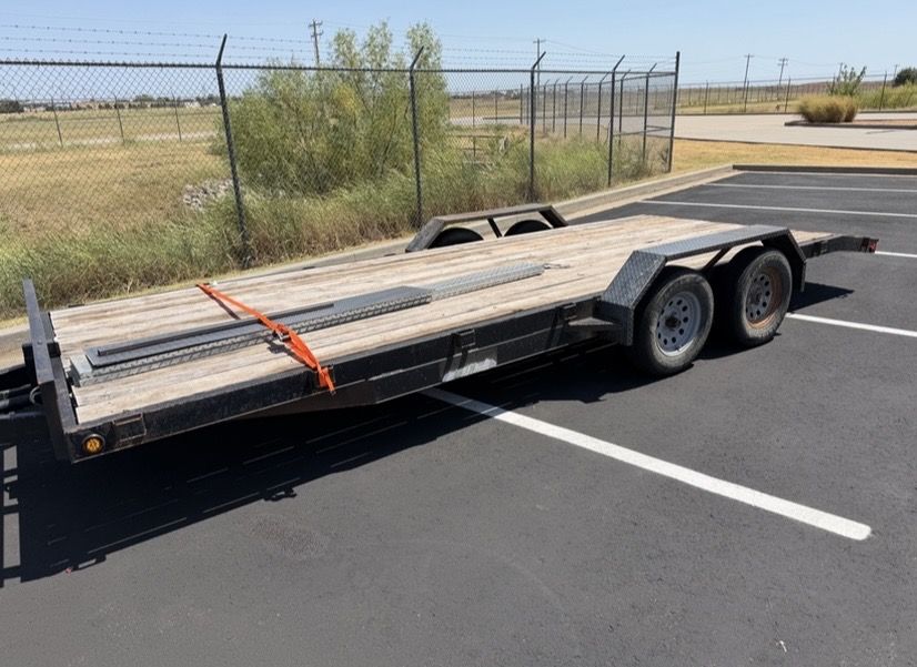 Drive over trailer fenders in bare 3/16 inch tread plate installed on a flatbed car hauler